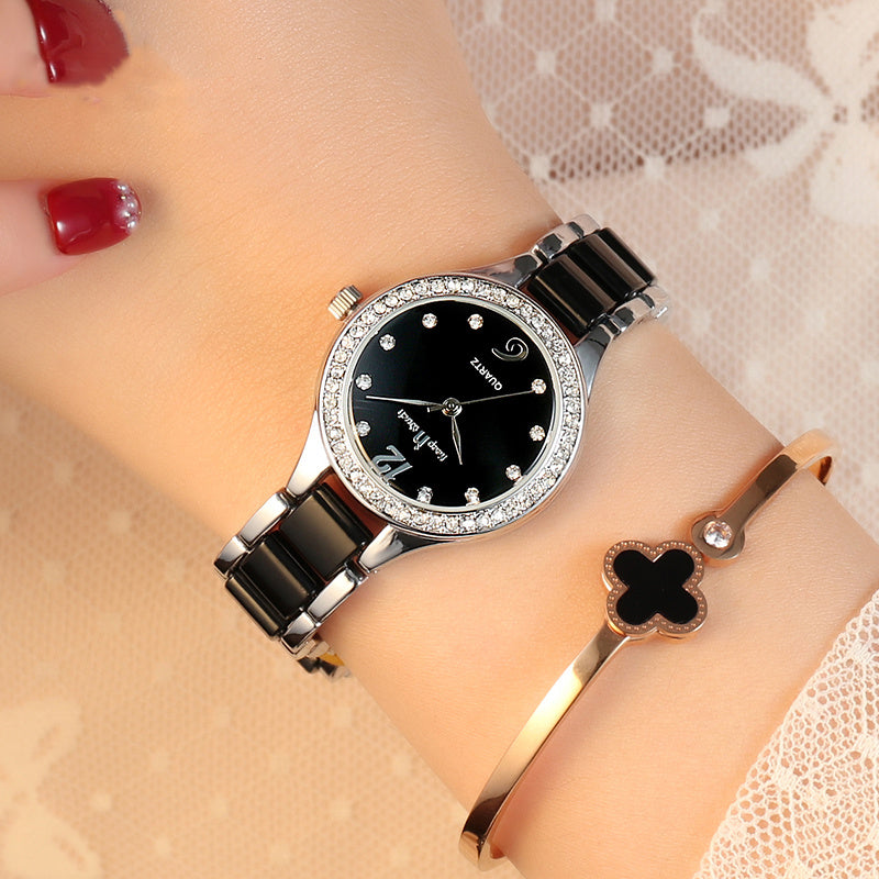 Women’s Luxury Watch with Black Dial, Crystal Bezel, and Silver Bracelet Strap